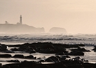 Another look at the Yaquina Bay lighthouse and the exposed basalt at low tide.