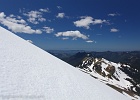 HELIOTROPE RIDGE BIVOUAC. Final ascent to the 7000-ft mark on Heliotrope Ridge while looking down on Marmot Ridge and off towards Vancouver.  Mt. Baker Wilderness, WA.
