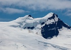 Long distance view of Colfax Peak from Chowder Ridge. The sharp-eyed will spot 21 climbers crossing the Coleman Glacier, heading to Mt. Baker&#39;s summit.