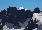 Glacier Peak many miles beyond a ridge coming off 8325-ft Mt. Formidable.  Middle Cascade Glacier in the foreground feeds the Cascade River.