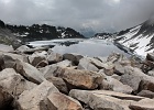 Dropping down to Hidden Lake (5733-ft) requires scrambling on boulder fields of granite, some blocks the size of cars.