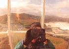 Yours truly reflected in the light&#39;s original copper reflector bowl.  Yaquina Head mirrored in the background.