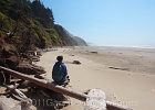 Yvonne enjoys the sun along the way on Ocean Beach, near Heceta Head.