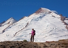 A dusty Mount Baker looms as Yvonne takes a look toward 14 Goat Lake.