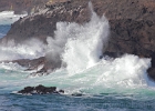 Small waves roll in to the rocks outside Whale Cove.