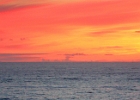 Sunset with gray whale tails in Depoe Bay.